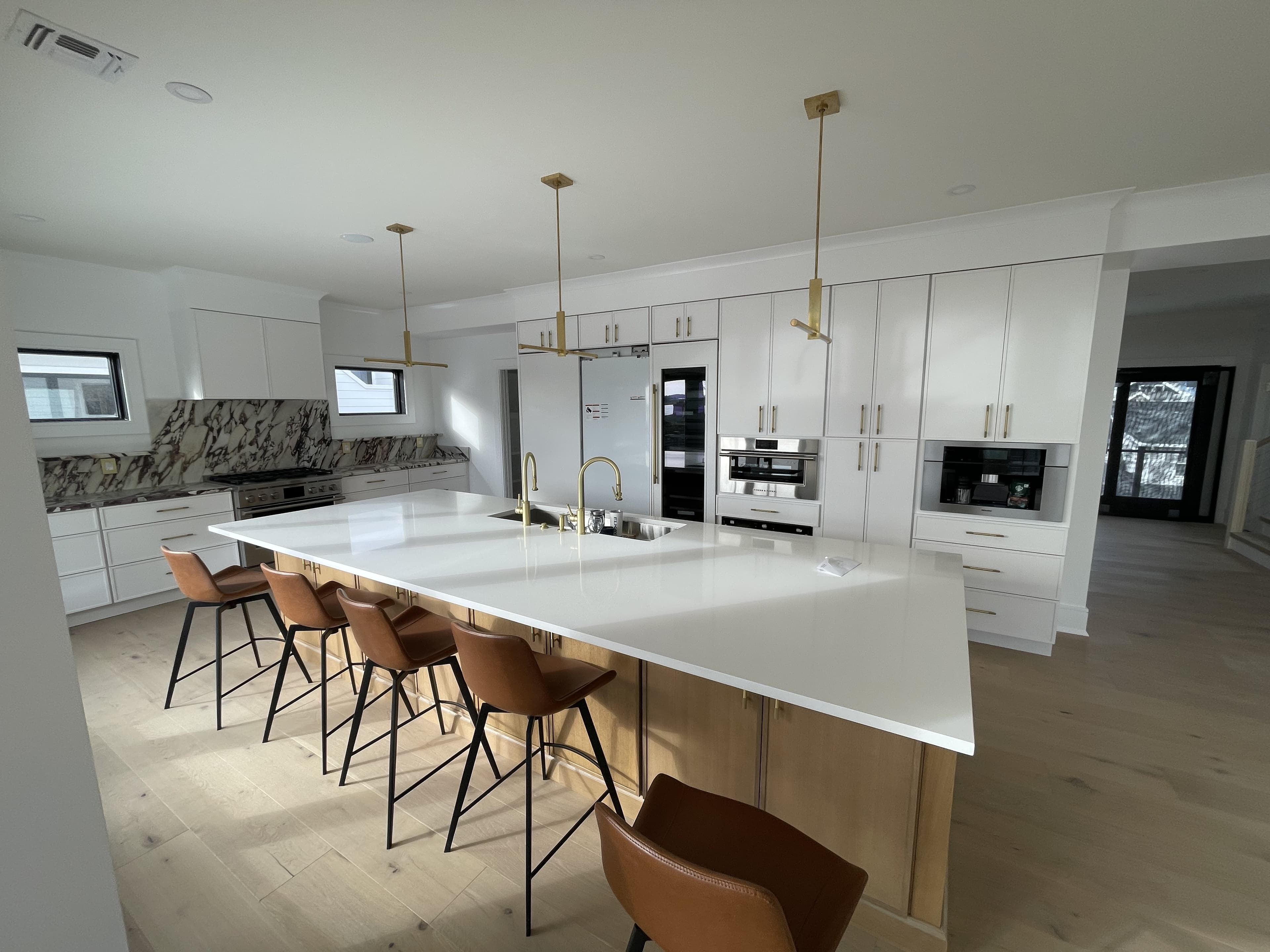 Open concept kitchen renovation with custom cabinetry